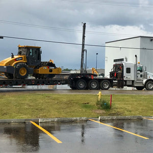 Japa Machinery truck delivering heavy equipment