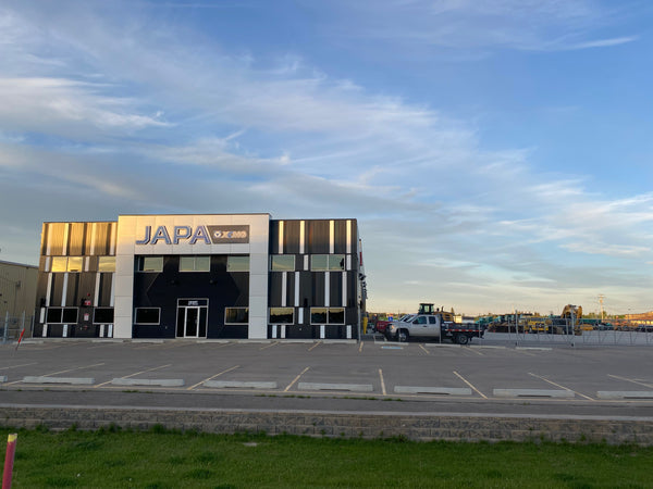 Exterior front view of the JAPA Machinery headquarters building, and parking lot