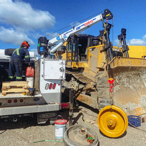 Japa Machinery technician performing on-site servicing on equipment