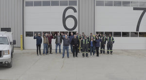 The Japa Machinery Team Photo outside the building bay doors